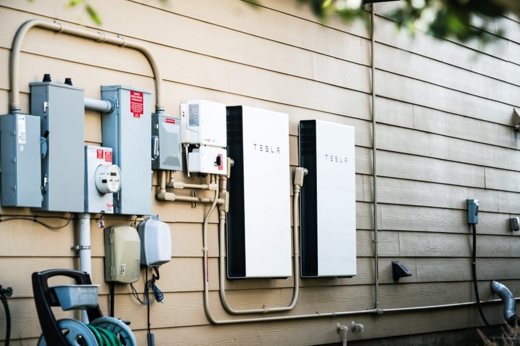 image of 2 tesla powerwalls attached to wall of house